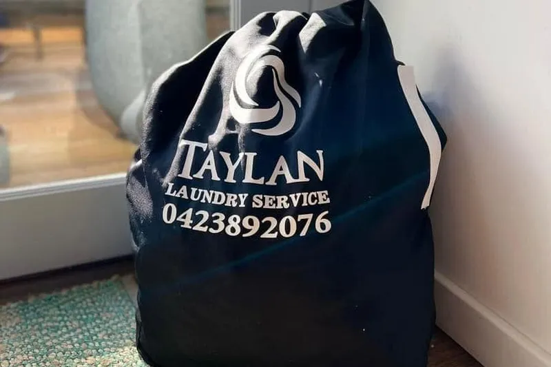 The Taylan laundry bag of fresh linen on a doormat
