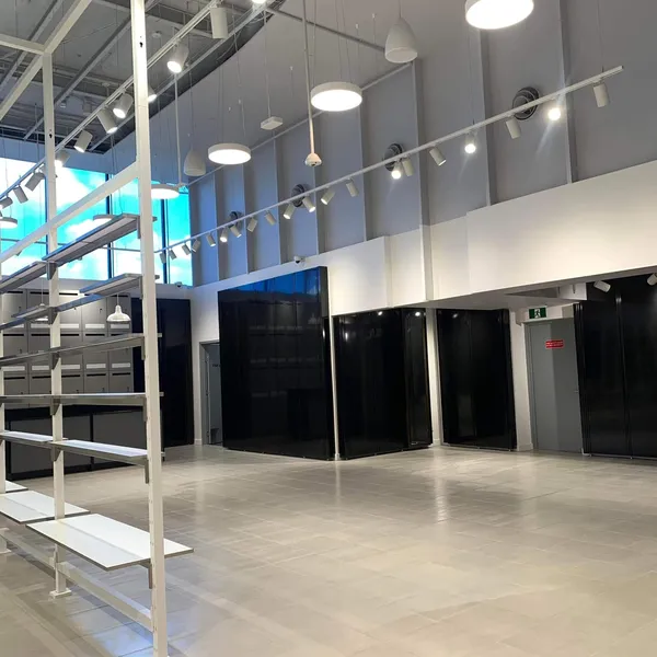 A cleaned commercial floor space under track lighting