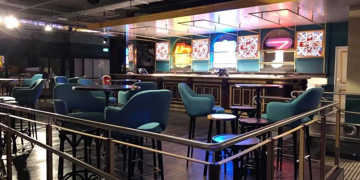 The bar and dining room at B. Lucky and Sons, floor and rails cleaned after a shift