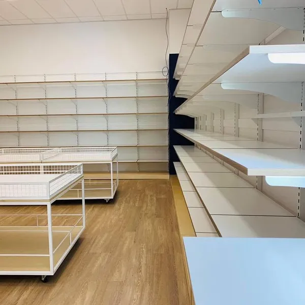 Empty retail shelving and timber floor in a new shop fit-out