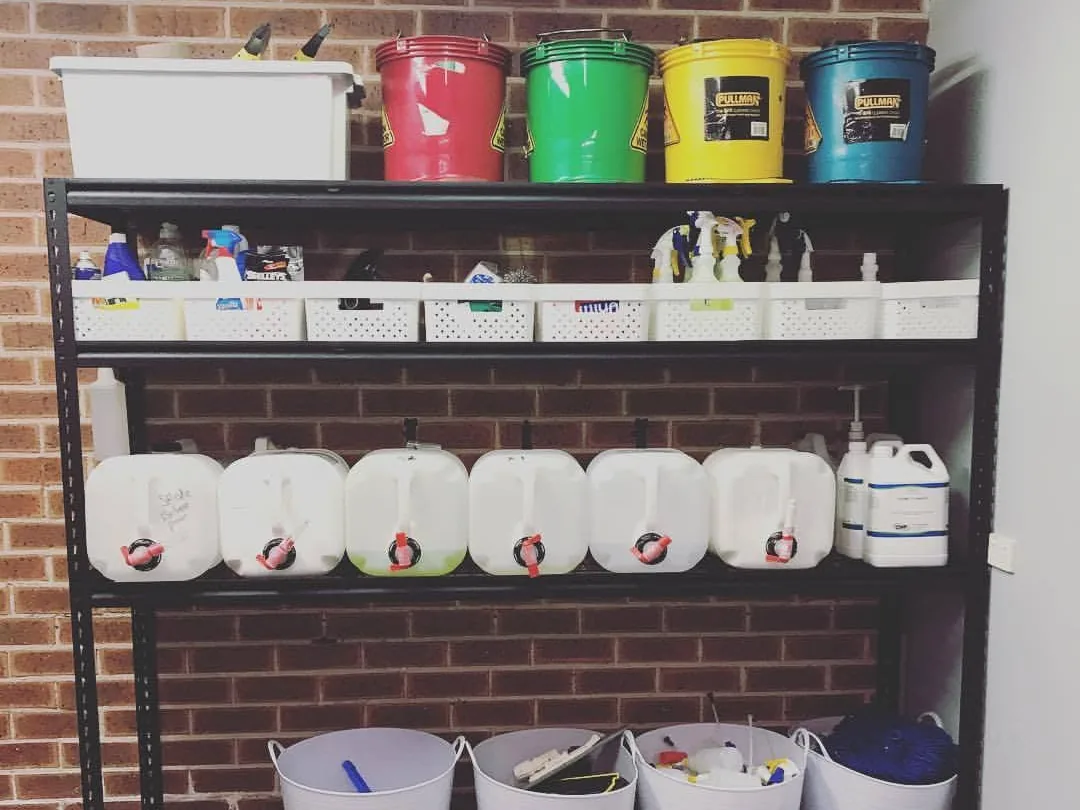 Shelves of cleaning products and equipment in the Taylan workshop